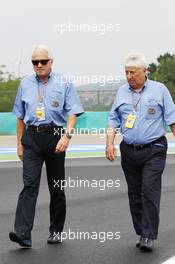 (L to R): Charlie Whiting (GBR) FIA Delegate walk the circuit with Herbie Blash (GBR) FIA Delegate. 26.07.2012. Formula 1 World Championship, Rd 11, Hungarian Grand Prix, Budapest, Hungary, Preparation Day