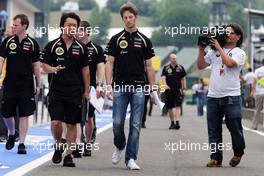 Romain Grosjean (FRA) Lotus F1 Team walks the circuit with Ayao Komatsu (JPN) Lotus F1 Team Race Engineer. 26.07.2012. Formula 1 World Championship, Rd 11, Hungarian Grand Prix, Budapest, Hungary, Preparation Day