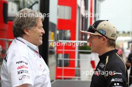 (L to R): Norbert Haug (GER) Mercedes Sporting Director with Kimi Raikkonen (FIN) Lotus F1 Team. 26.07.2012. Formula 1 World Championship, Rd 11, Hungarian Grand Prix, Budapest, Hungary, Preparation Day