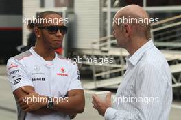(L to R): Lewis Hamilton (GBR) McLaren with Adrian Newey (GBR) Red Bull Racing Chief Technical Officer. 26.07.2012. Formula 1 World Championship, Rd 11, Hungarian Grand Prix, Budapest, Hungary, Preparation Day