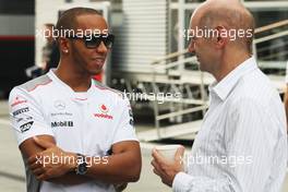 (L to R): Lewis Hamilton (GBR) McLaren with Adrian Newey (GBR) Red Bull Racing Chief Technical Officer. 26.07.2012. Formula 1 World Championship, Rd 11, Hungarian Grand Prix, Budapest, Hungary, Preparation Day