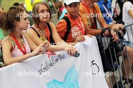 A banner of support from fans of Maria De Villota (ESP) Marussia F1 Team Test Driver in the pit lane walkabout. 26.07.2012. Formula 1 World Championship, Rd 11, Hungarian Grand Prix, Budapest, Hungary, Preparation Day