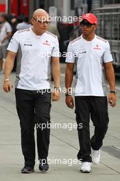 Lewis Hamilton (GBR) McLaren with Matt Bishop (GBR) McLaren Press Officer. 26.07.2012. Formula 1 World Championship, Rd 11, Hungarian Grand Prix, Budapest, Hungary, Preparation Day