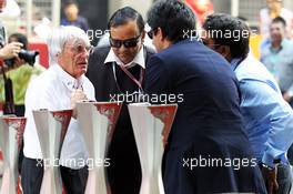 Bernie Ecclestone (GBR) CEO Formula One Group (FOM) with circuit management. 26.10.2012.Formula 1 World Championship, Rd 17, Indian Grand Prix, New Delhi, India, Practice Day.