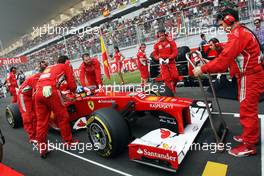 Fernando Alonso (ESP) Ferrari F2012 on the grid. 28.10.2012. Formula 1 World Championship, Rd 17, Indian Grand Prix, New Delhi, India, Race Day.