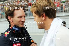 (L to R): Christian Horner (GBR) Red Bull Racing Team Principal with Sebastian Vettel (GER) Red Bull Racing on the grid. 28.10.2012. Formula 1 World Championship, Rd 17, Indian Grand Prix, New Delhi, India, Race Day.