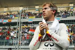 Sebastian Vettel (GER) Red Bull Racing on the grid. 28.10.2012. Formula 1 World Championship, Rd 17, Indian Grand Prix, New Delhi, India, Race Day.