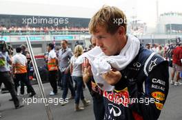 Sebastian Vettel (GER) Red Bull Racing on the grid. 28.10.2012. Formula 1 World Championship, Rd 17, Indian Grand Prix, New Delhi, India, Race Day.