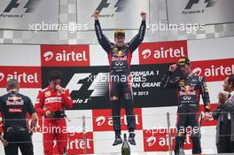 The podium (L to R): Fernando Alonso (ESP) Ferrari, second; Sebastian Vettel (GER) Red Bull Racing, race winner; Mark Webber (AUS) Red Bull Racing, third.. 28.10.2012. Formula 1 World Championship, Rd 17, Indian Grand Prix, New Delhi, India, Race Day.