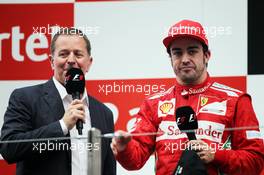 (L to R): Martin Brundle (GBR) Sky Sports Commentator with Fernando Alonso (ESP) Ferrari on the podium. 28.10.2012. Formula 1 World Championship, Rd 17, Indian Grand Prix, New Delhi, India, Race Day.