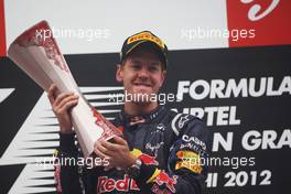 Race winner Sebastian Vettel (GER) Red Bull Racing celebrates  28.10.2012. Formula 1 World Championship, Rd 17, Indian Grand Prix, New Delhi, India, Race Day.
