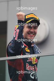 Race winner Sebastian Vettel (GER) Red Bull Racing celebrates on the podium. 28.10.2012. Formula 1 World Championship, Rd 17, Indian Grand Prix, New Delhi, India, Race Day.