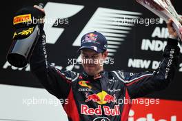 Race winner Sebastian Vettel (GER) Red Bull Racing celebrates on the podium. 28.10.2012. Formula 1 World Championship, Rd 17, Indian Grand Prix, New Delhi, India, Race Day.