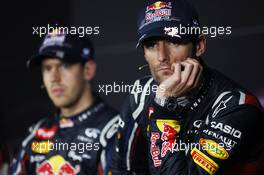 Mark Webber (AUS) Red Bull Racing and Sebastian Vettel (GER) Red Bull Racing in the FIA Press Conference. 28.10.2012. Formula 1 World Championship, Rd 17, Indian Grand Prix, New Delhi, India, Race Day.