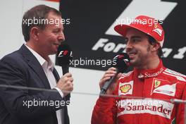 (L to R): Martin Brundle (GBR) Sky Sports Commentator with Fernando Alonso (ESP) Ferrari on the podium. 28.10.2012. Formula 1 World Championship, Rd 17, Indian Grand Prix, New Delhi, India, Race Day.