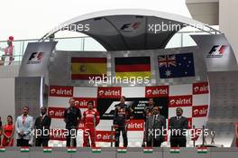 The podium (L to R): Fernando Alonso (ESP) Ferrari, second; Sebastian Vettel (GER) Red Bull Racing, race winner; Mark Webber (AUS) Red Bull Racing, third. 28.10.2012. Formula 1 World Championship, Rd 17, Indian Grand Prix, New Delhi, India, Race Day.