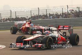 Jenson Button (GBR) McLaren MP4/27 leads Fernando Alonso (ESP) Ferrari F2012. 28.10.2012. Formula 1 World Championship, Rd 17, Indian Grand Prix, New Delhi, India, Race Day.