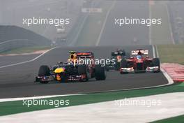 Mark Webber (AUS), Red Bull Racing and Fernando Alonso (ESP), Scuderia Ferrari  28.10.2012. Formula 1 World Championship, Rd 17, Indian Grand Prix, New Delhi, India, Race Day