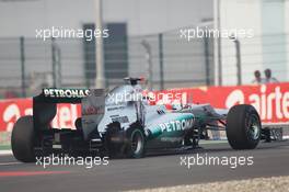 Michael Schumacher (GER) Mercedes AMG F1 W03 limps to the pits with a puncture. 28.10.2012. Formula 1 World Championship, Rd 17, Indian Grand Prix, New Delhi, India, Race Day.