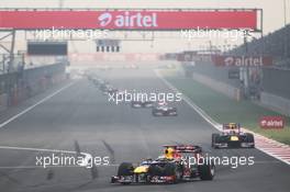 Sebastian Vettel (GER) Red Bull Racing RB8 leads at the start of lap 2. 28.10.2012. Formula 1 World Championship, Rd 17, Indian Grand Prix, New Delhi, India, Race Day.