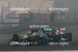 Nico Rosberg (GER) Mercedes AMG F1 W03 and Romain Grosjean (FRA) Lotus F1 E20 battle for position. 28.10.2012. Formula 1 World Championship, Rd 17, Indian Grand Prix, New Delhi, India, Race Day.