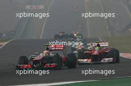 Lewis Hamilton (GBR) McLaren MP4/27 leads Felipe Massa (BRA) Ferrari F2012. 28.10.2012. Formula 1 World Championship, Rd 17, Indian Grand Prix, New Delhi, India, Race Day.