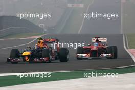 Mark Webber (AUS), Red Bull Racing and Fernando Alonso (ESP), Scuderia Ferrari  28.10.2012. Formula 1 World Championship, Rd 17, Indian Grand Prix, New Delhi, India, Race Day