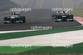 Bruno Senna (BRE), Williams F1 Team and Nico Rosberg (GER), Mercedes GP  28.10.2012. Formula 1 World Championship, Rd 17, Indian Grand Prix, New Delhi, India, Race Day