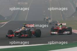 Lewis Hamilton (GBR) McLaren MP4/27 leads Felipe Massa (BRA) Ferrari F2012. 28.10.2012. Formula 1 World Championship, Rd 17, Indian Grand Prix, New Delhi, India, Race Day.