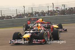 Sebastian Vettel (GER) Red Bull Racing RB8 leads team mate Mark Webber (AUS) Red Bull Racing RB8. 28.10.2012. Formula 1 World Championship, Rd 17, Indian Grand Prix, New Delhi, India, Race Day.