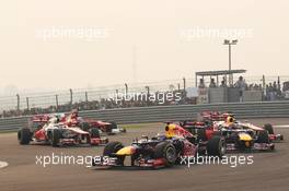 Sebastian Vettel (GER) Red Bull Racing RB8 leads at the start of the race. 28.10.2012. Formula 1 World Championship, Rd 17, Indian Grand Prix, New Delhi, India, Race Day.