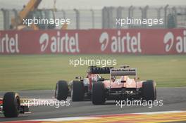 Mark Webber (AUS) Red Bull Racing RB8 and Fernando Alonso (ESP) Ferrari F2012 battle for position. 28.10.2012. Formula 1 World Championship, Rd 17, Indian Grand Prix, New Delhi, India, Race Day.