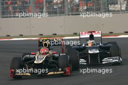 Romain Grosjean (FRA), Lotus F1 Team and Pastor Maldonado (VEN), Williams F1 Team  28.10.2012. Formula 1 World Championship, Rd 17, Indian Grand Prix, New Delhi, India, Race Day