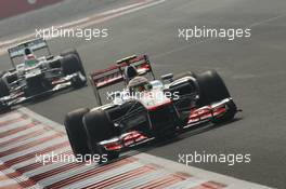 Lewis Hamilton (GBR) McLaren MP4/27 leads Sergio Perez (MEX) Sauber C31. 27.10.2012. Formula 1 World Championship, Rd 17, Indian Grand Prix, New Delhi, India, Qualifying Day.