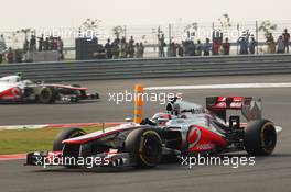Jenson Button (GBR) McLaren MP4/27 leads team mate Lewis Hamilton (GBR) McLaren MP4/27. 27.10.2012. Formula 1 World Championship, Rd 17, Indian Grand Prix, New Delhi, India, Qualifying Day.