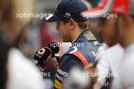 Sebastian Vettel (GER) Red Bull Racing with the media. 27.10.2012. Formula 1 World Championship, Rd 17, Indian Grand Prix, New Delhi, India, Qualifying Day.