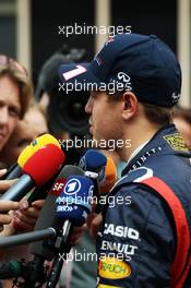 Sebastian Vettel (GER) Red Bull Racing with the media. 27.10.2012. Formula 1 World Championship, Rd 17, Indian Grand Prix, New Delhi, India, Qualifying Day.