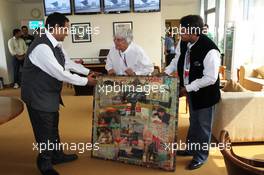 Bernie Ecclestone (GBR) CEO Formula One Group (FOM) is presented with gifts by Manoj Gaur (IND) Executive Chairman and CEO Jaypee Group and Sameer Gaur (IND), MD & CEO Jaypee Sports International Ltd on his 82nd birthday. 28.10.2012. Formula 1 World Championship, Rd 17, Indian Grand Prix, New Delhi, India, Race Day.