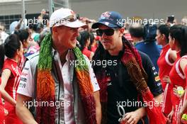 (L to R): Michael Schumacher (GER) Mercedes AMG F1 and Sebastian Vettel (GER) Red Bull Racing on the drivers parade. 28.10.2012. Formula 1 World Championship, Rd 17, Indian Grand Prix, New Delhi, India, Race Day.