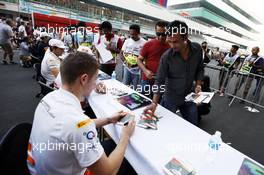 Paul di Resta (GBR) Sahara Force India VJM05 signs autographs for the fans. 25.10.2012. Formula 1 World Championship, Rd 17, Indian Grand Prix, New Delhi, India, Preparation Day