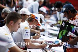 (L to R): Paul di Resta (GBR) Sahara Force India F1 and Nico Hulkenberg (GER) Sahara Force India F1 sign autographs for the fans. 25.10.2012. Formula 1 World Championship, Rd 17, Indian Grand Prix, New Delhi, India, Preparation Day