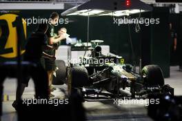 Caterham CT01 in the pit garage at night. 25.10.2012. Formula 1 World Championship, Rd 17, Indian Grand Prix, New Delhi, India, Preparation Day