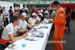 (L to R): Paul di Resta (GBR) Sahara Force India F1 with Nico Hulkenberg (GER) Sahara Force India F1 sign autographs for the fans. 25.10.2012. Formula 1 World Championship, Rd 17, Indian Grand Prix, New Delhi, India, Preparation Day