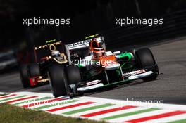 Nico Hulkenberg (GER) Sahara Force India F1 VJM05 leads Jerome d'Ambrosio (BEL) Lotus F1 E20. 07.09.2012. Formula 1 World Championship, Rd 13, Italian Grand Prix, Monza, Italy, Practice Day