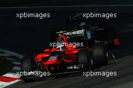 Charles Pic (FRA) Marussia F1 Team MR01 leads Ma Qing Hua (CHN) Hispania Racing F1 Team (HRT) F112 Test Driver. 07.09.2012. Formula 1 World Championship, Rd 13, Italian Grand Prix, Monza, Italy, Practice Day