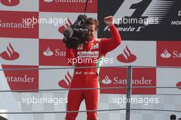 Fernando Alonso (ESP) Ferrari takes control of a FOM camera on the podium. 09.09.2012. Formula 1 World Championship, Rd 13, Italian Grand Prix, Monza, Italy, Race Day