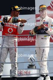 (L to R): Race winner Lewis Hamilton (GBR) McLaren and second placed Sergio Perez (MEX) Sauber celebrate on the podium. 09.09.2012. Formula 1 World Championship, Rd 13, Italian Grand Prix, Monza, Italy, Race Day