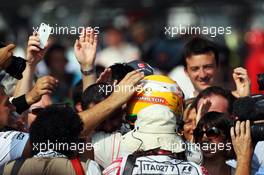 Race winner Lewis Hamilton (GBR) McLaren celebrates with the team in parc ferme. 09.09.2012. Formula 1 World Championship, Rd 13, Italian Grand Prix, Monza, Italy, Race Day
