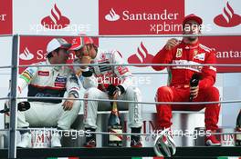 The podium (L to R): Sergio Perez (MEX) Sauber, second; Lewis Hamilton (GBR) McLaren, race winner; Fernando Alonso (ESP) Ferrari, third. 09.09.2012. Formula 1 World Championship, Rd 13, Italian Grand Prix, Monza, Italy, Race Day