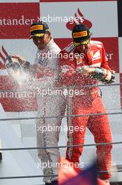 (L to R): Race winner Lewis Hamilton (GBR) McLaren and third placed Fernando Alonso (ESP) Ferrari celebrate on the podium. 09.09.2012. Formula 1 World Championship, Rd 13, Italian Grand Prix, Monza, Italy, Race Day